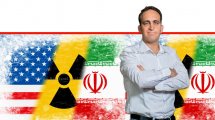 ערן שישון, מנכל קבוצת רעות האגודה הישראלית ברקע: דגלי איראן וארה"ב וסמל אזהרה לחומר רדיואקטיבי  | עיבוד צילום: שולי סונגו ©