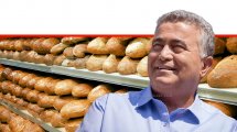שר הכלכלה והתעשייה, עמיר פרץ, ברקע: כיכרות לחם על המדפים | צילום: Stock Image & Photo | עיבוד צילום: שולי סונגו ©