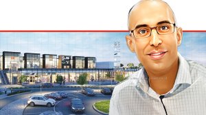 הראל שרעבי ראש חטיבת כספים ורכש של "שירותי בריאות לאומית" ברקע: מגדל עיר ג'י ראשון לציון צילום: WAWA – תכנון בר קיימא ואדריכלות ירוקה | עיבוד: בינה מלאכותית של עPhotolab | עיבוד צילום: שולי סונגו©