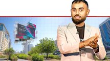 ווגאר אוסי זייד, מנהל התפעול הראשי של Bitget ברקע: קמפיין שיווקי ב-דובאי "לכו אל הקריפטו - תצעדו. תזיעו. תשיגו... | צילום בינה מלאכותית של Gemini Google | עיבוד: Photolab | עיבוד צילום: שולי סונגו©