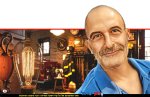 גיורא אלדן בטור אישי על נוּרת 60 ואט, שדולקת משנת 1901 בתחנת כיבוי אש מספר 6 ב-ליברמור, קליפורניה ברקע: מנורת Centennial | הדמייה באמצעות בינה מלאכותית של Gemini Google | עיבוד: Photolab | עיבוד צילום: שולי סונגו©